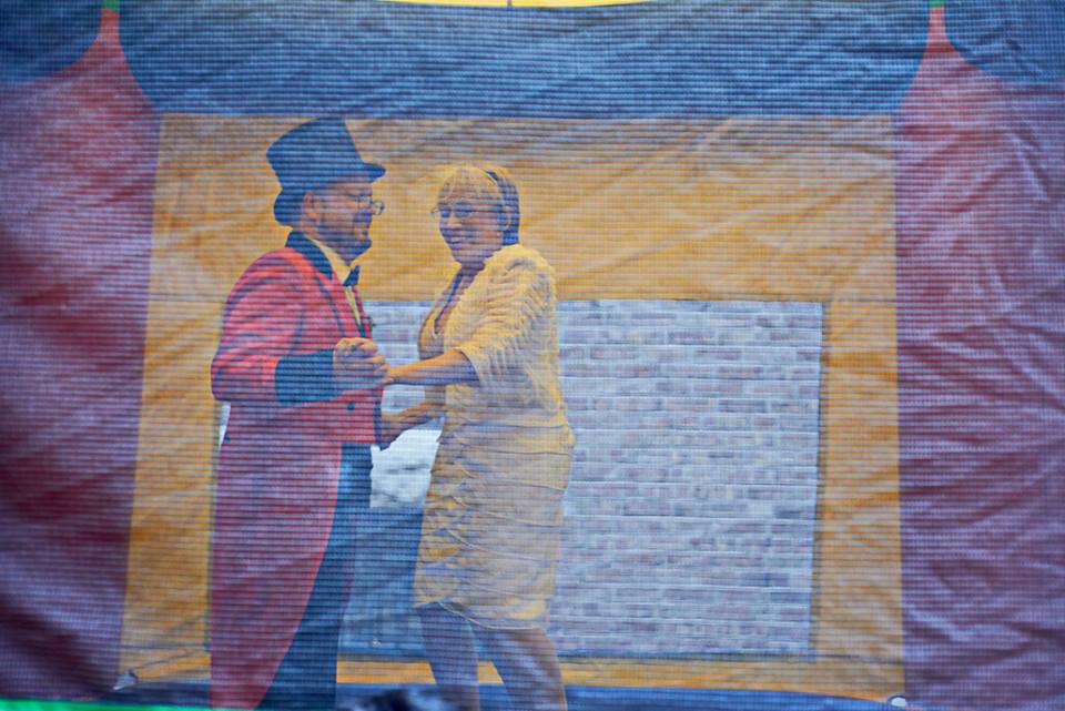 A newly married couple bounces together in a bouncy castle