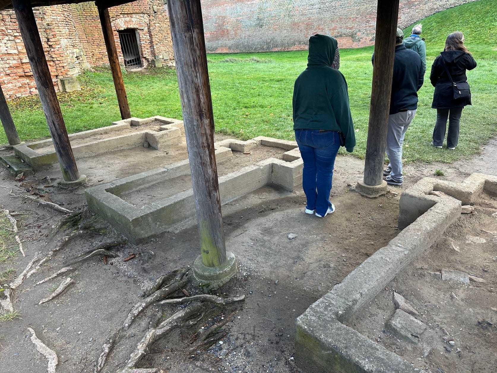 Three concrete outlines of crosses on the ground