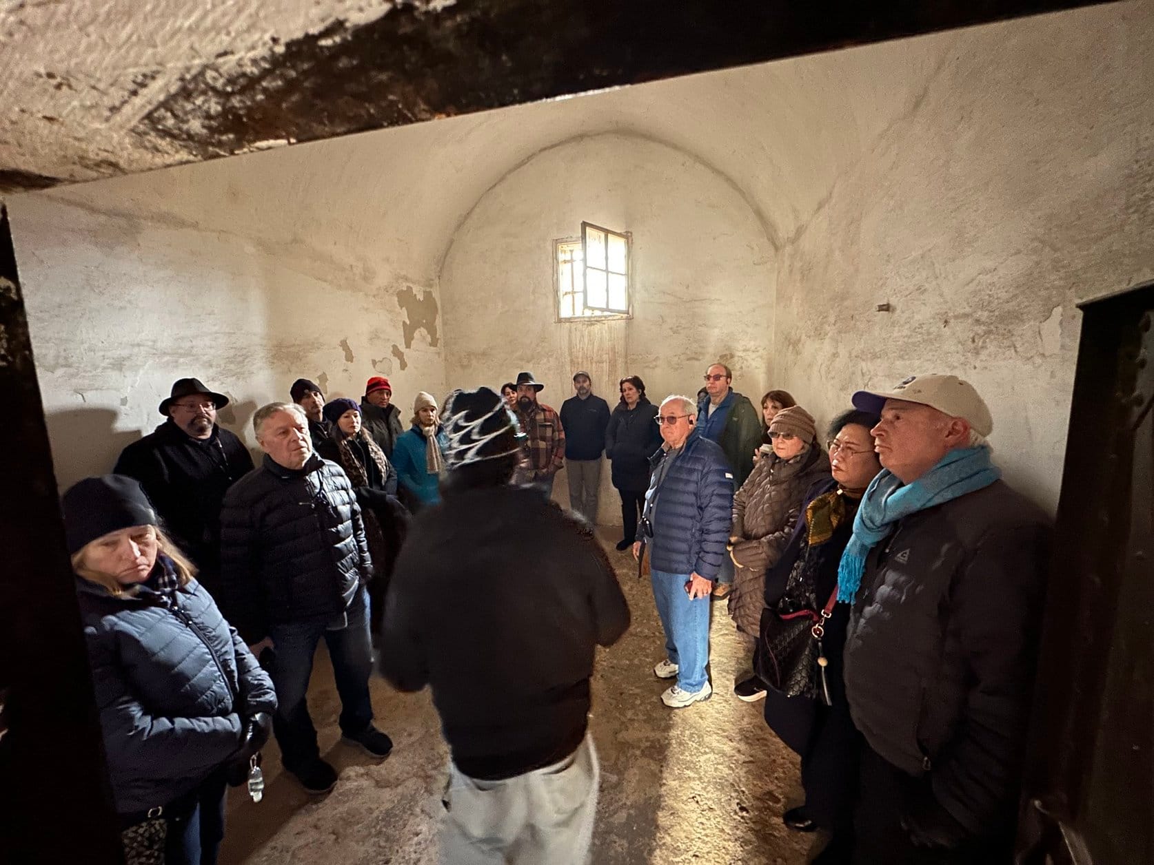 A few dozen people in a cramped room that once held hundreds