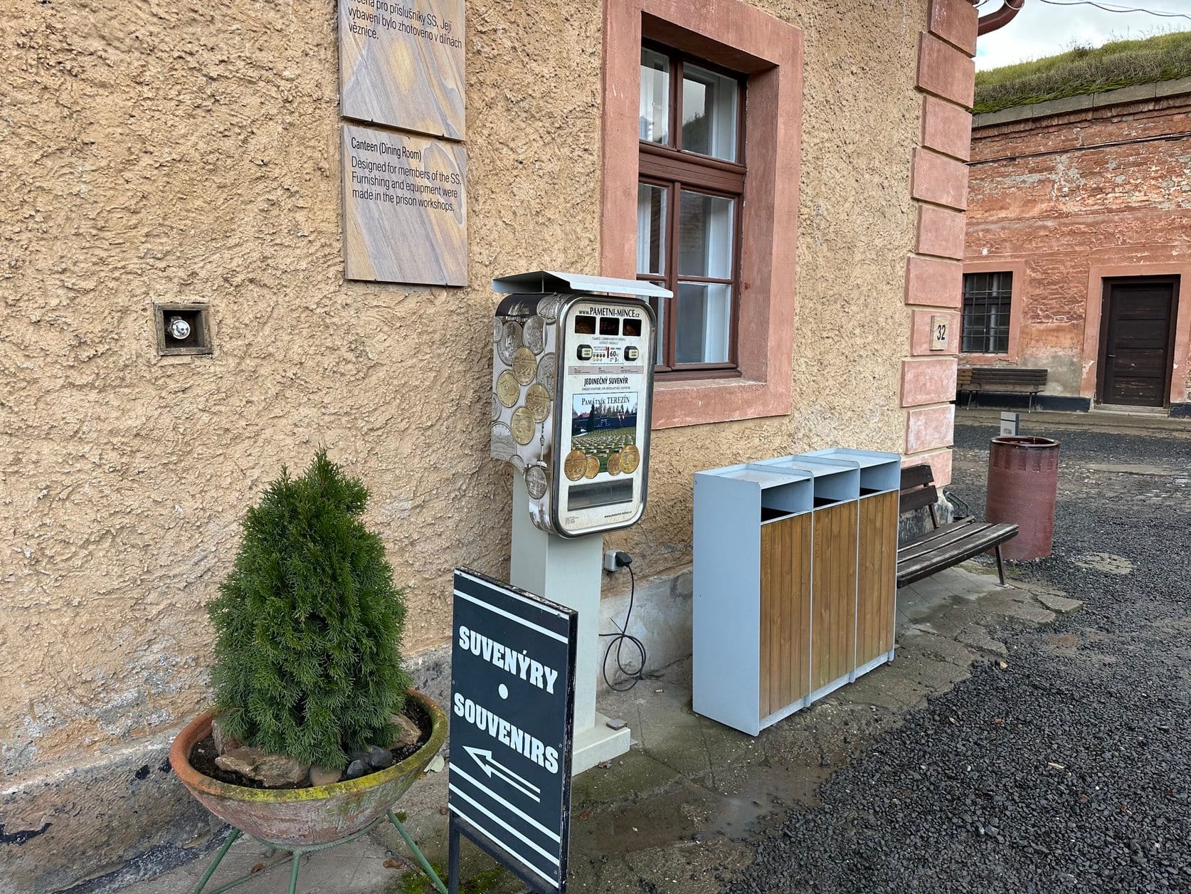 Image of a Souvenirs sign and a collectors coin machine